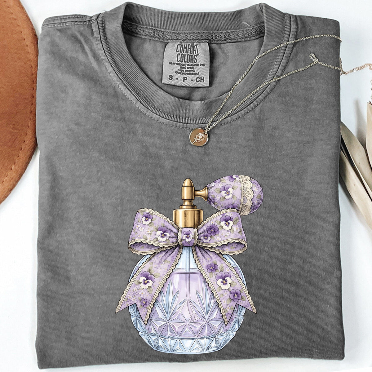 Vintage Perfume Bottle Tee – Purple Coquette Bow Graphic Tee