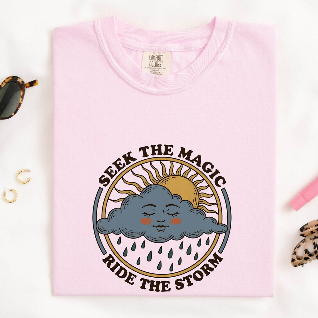 Seek the Magic Ride the Storm Tee – Inspirational Sun and Rain Graphic Tee