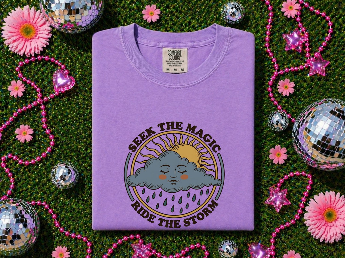 Seek the Magic Ride the Storm Tee – Inspirational Sun and Rain Graphic Tee