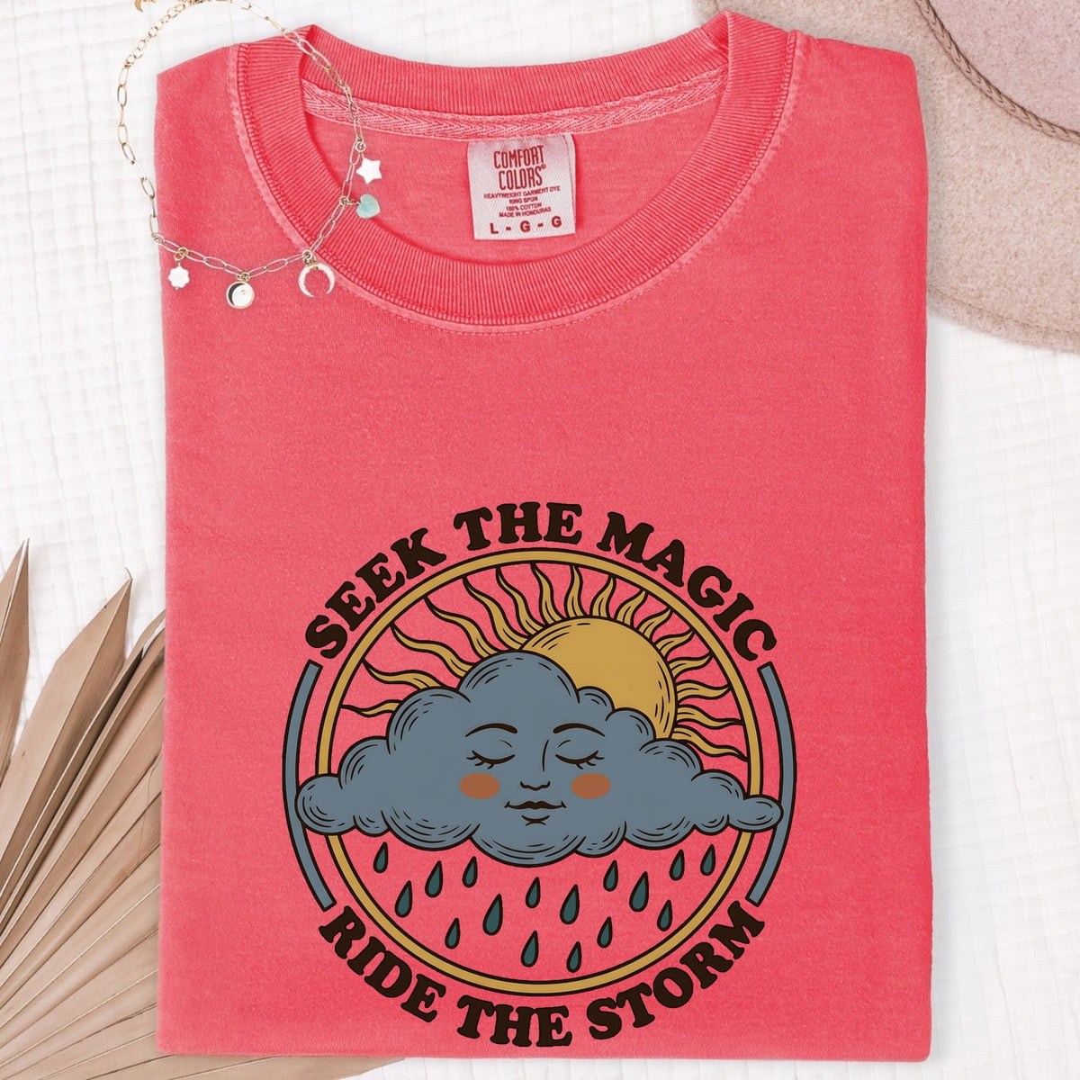 Seek the Magic Ride the Storm Tee – Inspirational Sun and Rain Graphic Tee